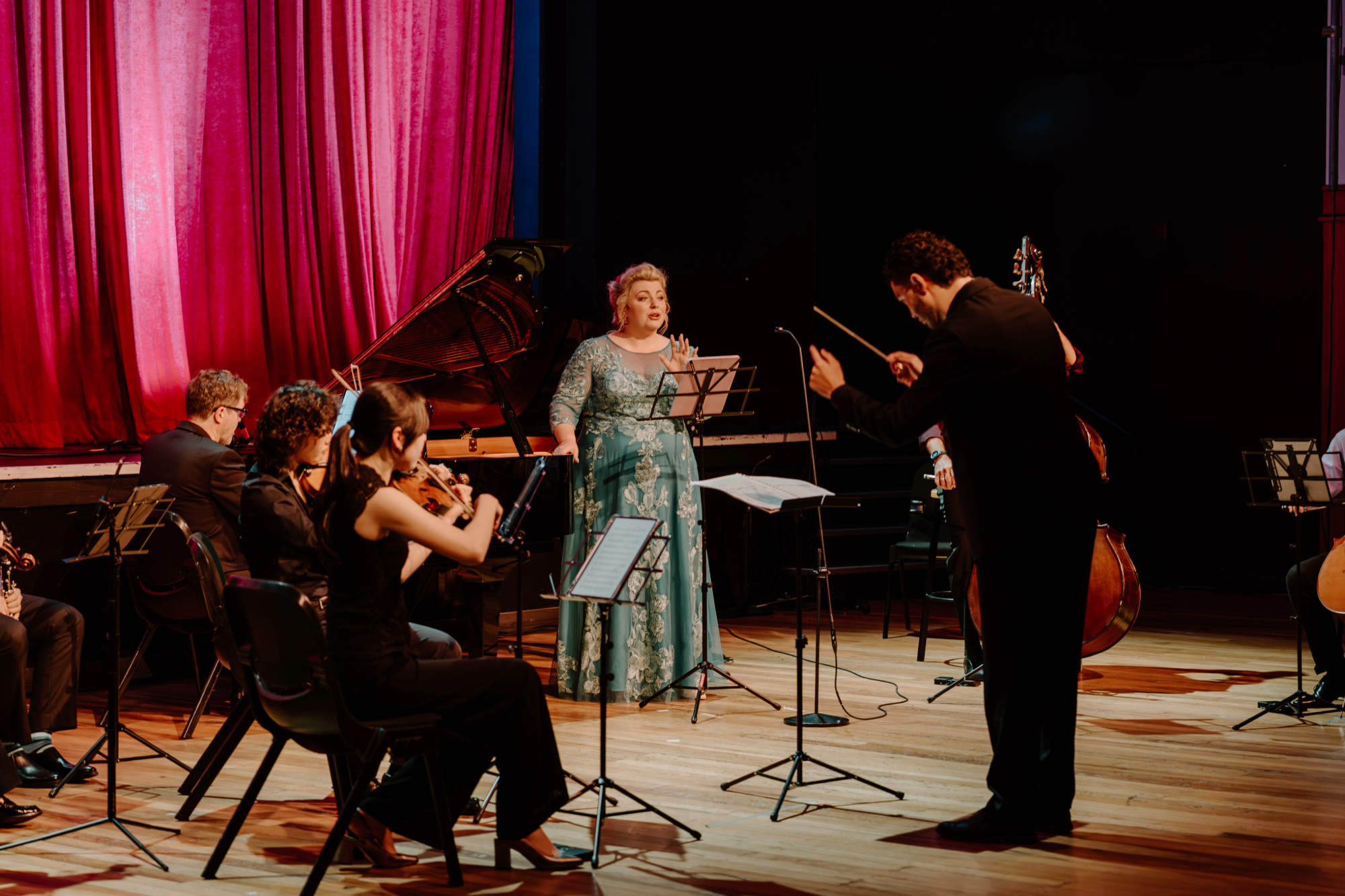 Felicity Tomkins (soprano performing with an orchestra and conducted by Reuben Brown